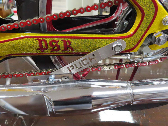 Exhaust bracket Puch Maxi N / K stainless steel with Puch text product