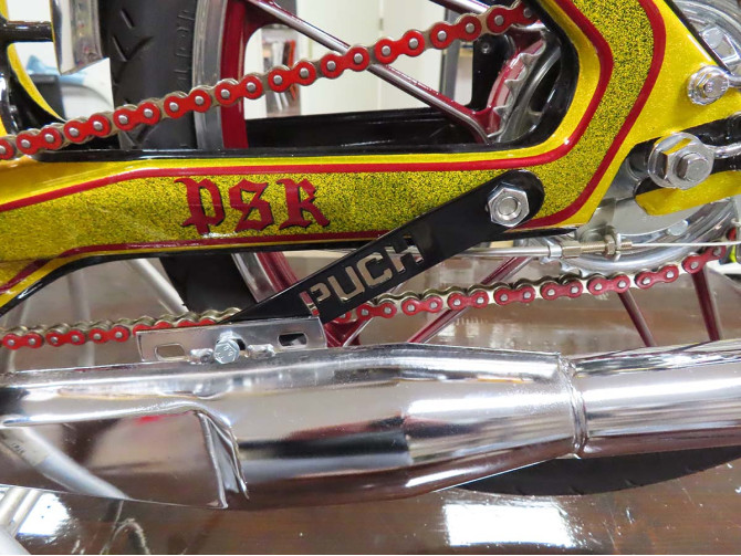 Exhaust bracket Puch Maxi N / K stainless steel with Puch text black  product